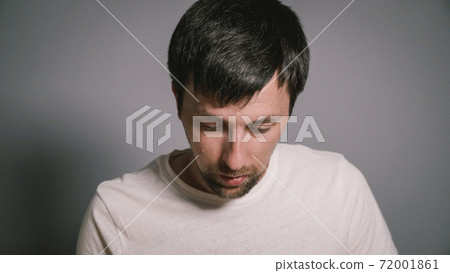 Male have flu, virus or allergy. Healthy medicine and people concept. Sick guy sit on bed and has runny nose. Allergies, runny nose and sneezing. Disease. Cheer at home. Blowing Nose 72001861