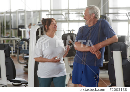 Happy senior couple at gym. 72003188