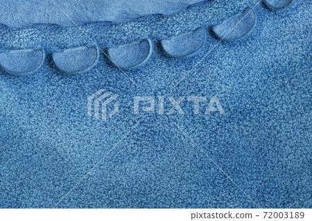 Hand made sewing stitch of craft leather handbag, blue leather texture. Concept of manufacture of accessories 72003189