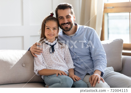 Portrait of loving dad and daughter relax at home Portrait of loving dad and daughter relax at home 72004115
