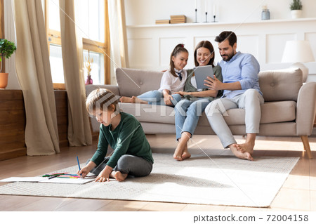Happy Caucasian family relax at home with kids Happy Caucasian family relax at home with kids 72004158