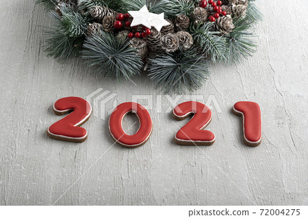 Happy New Year 2021. Red ginger bread cookies and Merry Christmas background. 72004275