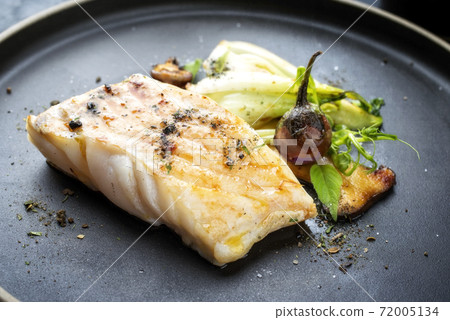 Modern style Thai fried skrei cod fish filet with bok choi and mushrooms Modern style Thai fried skrei cod fish filet with bok choi and mushrooms 72005134