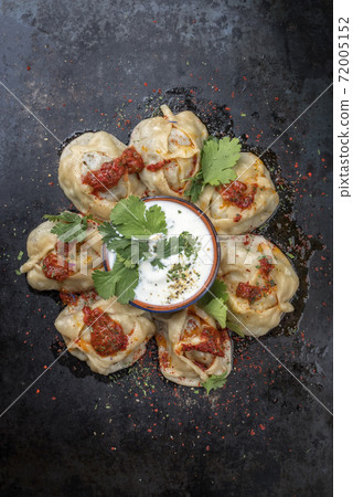 Traditional Uzdek manti steamed with mincemeat with tartar Traditional Uzdek manti steamed with mincemeat with tartar 72005152