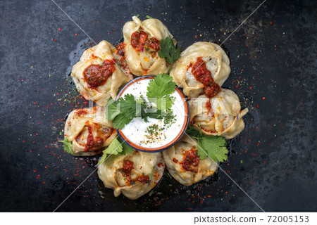 Traditional Uzdek manti steamed with mincemeat with tartar Traditional Uzdek manti steamed with mincemeat with tartar 72005153