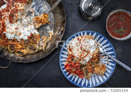Traditional Uzdek manti steamed with mincemeat with tartar Traditional Uzdek manti steamed with mincemeat with tartar 72005154