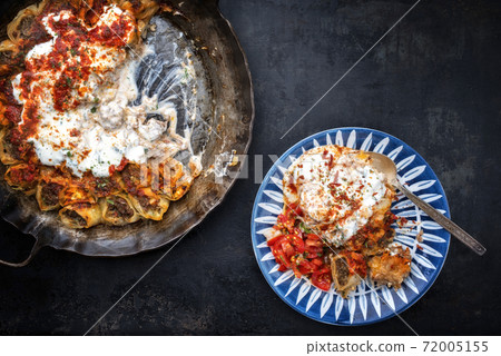 Traditional Uzdek manti steamed with mincemeat with tartar  72005155