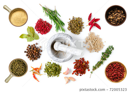 Various spice and herbs scattered on white background 72005323