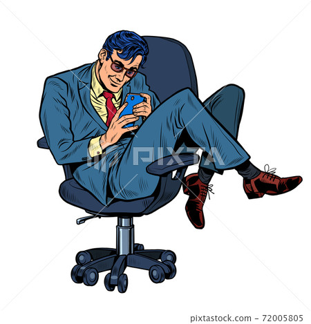 Businessman in an office chair looking at a smartphone 72005805