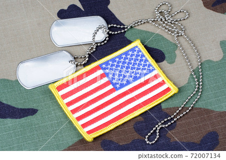 US flag patch with dog tags on woodland camouflage uniform 72007134