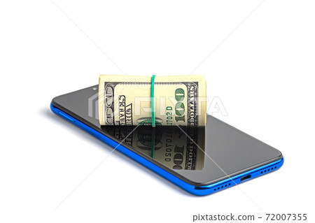 Roll of dollar bills tied with an elastic band and a mobile phone on a white background. Roll of dollar bills tied with an elastic band and a mobile phone on a white background. 72007355