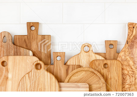 Kitchen utensils on countertop, culinary background, wooden and white ceramic kitchenware, home cooking concept Kitchen utensils on countertop, culinary background, wooden and white ceramic kitchenware, home cooking concept 72007363
