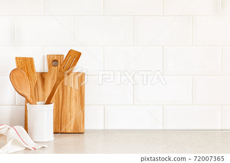 Kitchen utensils on countertop, culinary background, wooden and white ceramic kitchenware, home cooking concept Kitchen utensils on countertop, culinary background, wooden and white ceramic kitchenware, home cooking concept 72007365