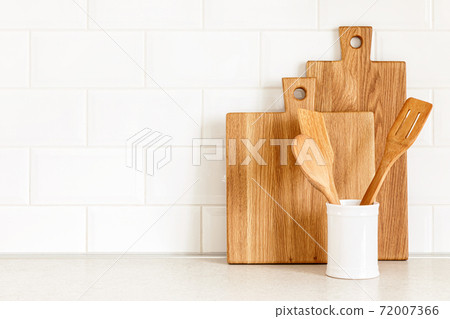Kitchen utensils on countertop, culinary background, wooden and white ceramic kitchenware, home cooking concept 72007366