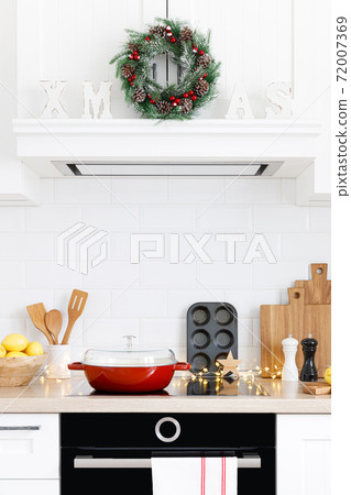 Christmas home kitchen interior with wooden worktop and kitchenware, holiday cooking background Christmas home kitchen interior with wooden worktop and kitchenware, holiday cooking background 72007369