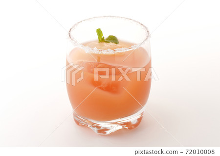 Photographed a pink salty dog with mint with salt on the edge of the glass on a white background Photographed a pink salty dog with mint with salt on the edge of the glass on a white background 72010008