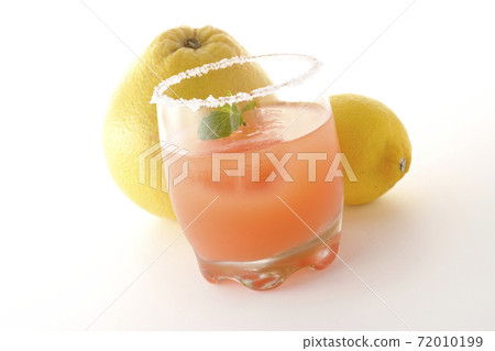 Photographed pink salty dog with mint with salt on the edge of the glass, grapefruit and lemon on a white background Photographed pink salty dog with mint with salt on the edge of the glass, grapefruit and lemon on a white background 72010199