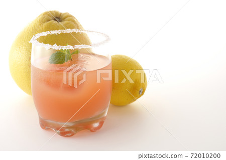 Photographed pink salty dog with mint with salt on the edge of the glass, grapefruit and lemon on a white background Photographed pink salty dog with mint with salt on the edge of the glass, grapefruit and lemon on a white background 72010200
