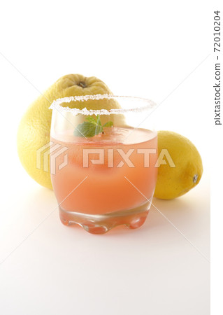 Photographed pink salty dog with mint with salt on the edge of the glass, grapefruit and lemon on a white background Photographed pink salty dog with mint with salt on the edge of the glass, grapefruit and lemon on a white background 72010204