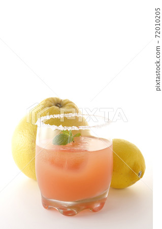Photographed pink salty dog with mint with salt on the edge of the glass, grapefruit and lemon on a white background Photographed pink salty dog with mint with salt on the edge of the glass, grapefruit and lemon on a white background 72010205