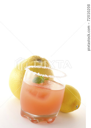 Photographed pink salty dog with mint with salt on the edge of the glass, grapefruit and lemon on a white background Photographed pink salty dog with mint with salt on the edge of the glass, grapefruit and lemon on a white background 72010208