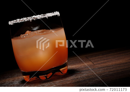 Pink salty dog with salt on the edge of the glass Pink salty dog with salt on the edge of the glass 72011173