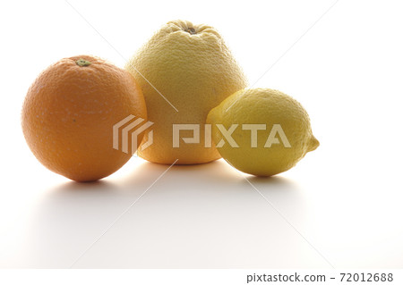 Photographed grapefruit, orange and lemon on a white background 72012688