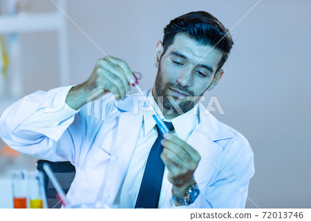 Research scientists analysing test trial new generation vaccine data. 72013746