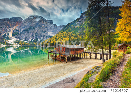 Spectacular wooden boathouse on the alpine lake,Dolomites,Italy,Europe 72014707