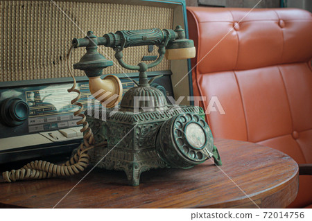 Old telephone retro rotary phone antique style in vintage room 72014756