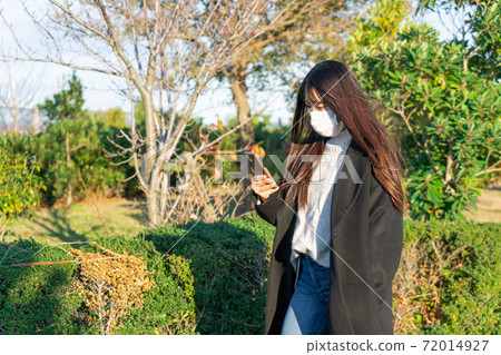 Mask smartphone park walk woman Mask smartphone park walk woman 72014927