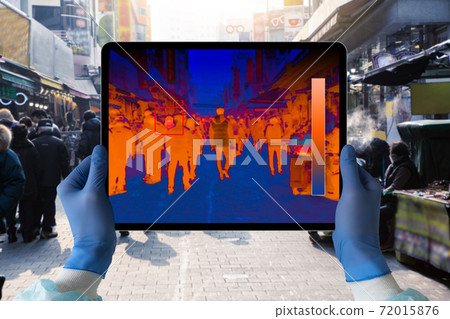 Hands with digital tablet with a thermal imager Hands with digital tablet with a thermal imager 72015876