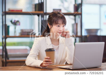 Woman working in Sure office Woman working in Sure office 72016201
