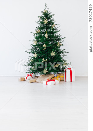 Winter Christmas tree pine with gifts decor interior new year Winter Christmas tree pine with gifts decor interior new year 72017439