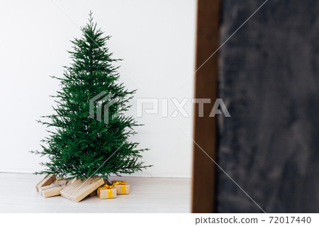Winter Christmas tree pine with gifts decor interior new year Winter Christmas tree pine with gifts decor interior new year 72017440