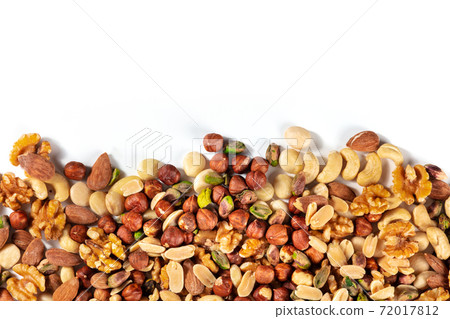 Nuts, overhead shot on a white background with copy space Nuts, overhead shot on a white background with copy space 72017812