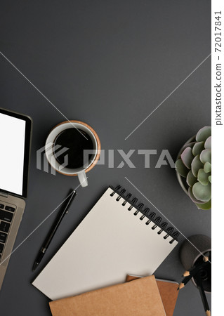 Top view of worktable with laptop, stationery, coffee cup, decorations and copy space Top view of worktable with laptop, stationery, coffee cup, decorations and copy space 72017841