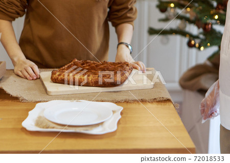 New Year's, Christmas culinary composition from food of generic background, intentionally blurred post production. cake with apples for the new year's table. Bokeh as background. New Year's, Christmas culinary composition from food of generic background, intentionally blurred post production. cake with apples for the new year's table. Bokeh as background. 72018533