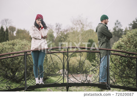 Couple standing separately after having an argument bad vibes. Couple standing separately after having an argument bad vibes. 72020087