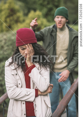 Sad woman being offended by his boyfriend Sad woman being offended by his boyfriend 72020108