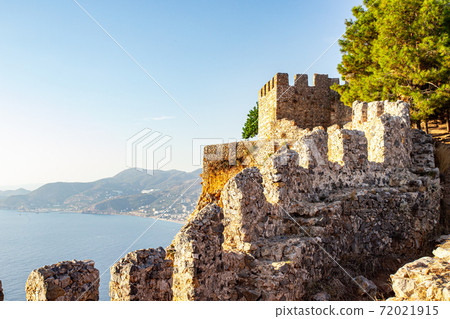 Elements of an ancient fortress. ancient city. Fortress on the rocks. Ruined walls of a medieval castle on the mountain. Elements of an ancient fortress. ancient city. Fortress on the rocks. Ruined walls of a medieval castle on the mountain. 72021915