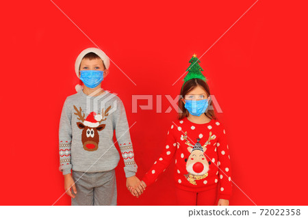 A boy and a girl wearing respiratory masks keep their distance A boy and a girl wearing respiratory masks keep their distance 72022358