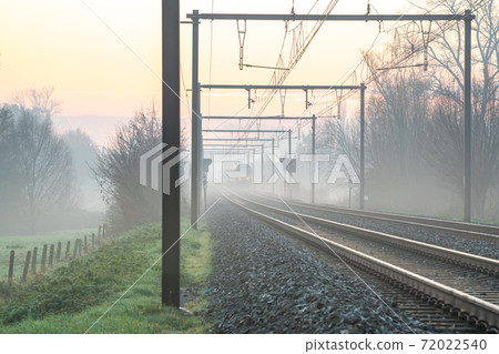 Sunrise to the track whit an train Sunrise to the track whit an train 72022540