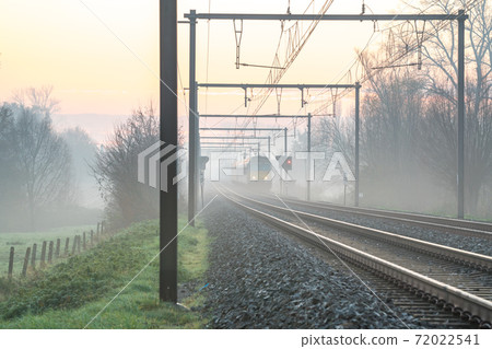 Sunrise to the track whit an train 72022541