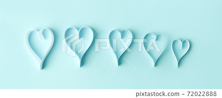 Row of Paper hearts over the blue pastel background. Abstract background with paper cut shapes. Sainte Valentine, mother's day, birthday wedding greeting cards, invitation, celebration concept, banner Row of Paper hearts over the blue pastel background. Abstract background with paper cut shapes. Sainte Valentine, mother's day, birthday wedding greeting cards, invitation, celebration concept, banner 72022888