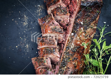 Traditional barbecue aged saddle of venison marinated Traditional barbecue aged saddle of venison marinated 72023739