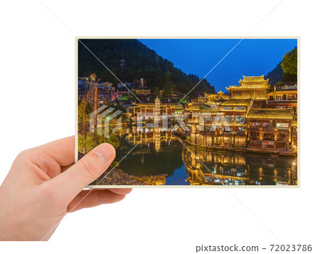 Hand and Ancient town Fenghuang at sunset in Hunan China (my photo) Hand and Ancient town Fenghuang at sunset in Hunan China (my photo) 72023786
