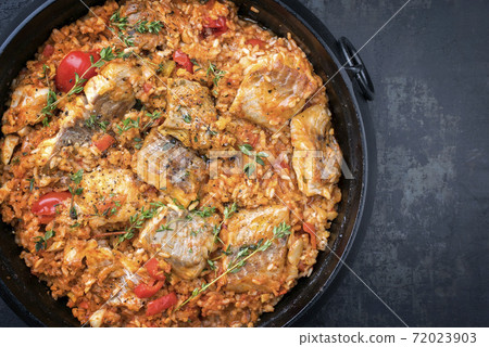 Traditional Louisiana fish jambalaya dish creole cajun with rice and tomatoes 72023903