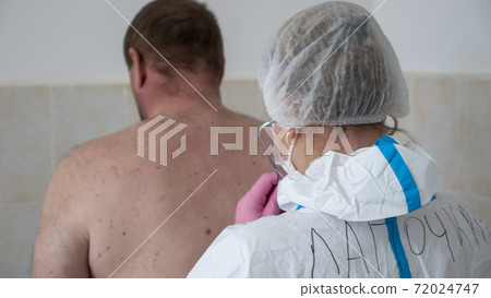 Examination of the patient. Listening to the lungs with a phonendoscope. Examination of the patient. Listening to the lungs with a phonendoscope. 72024747