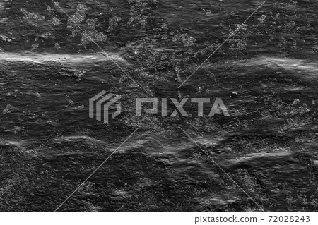Photo of surface with scratches on dark backgrounds 72028243